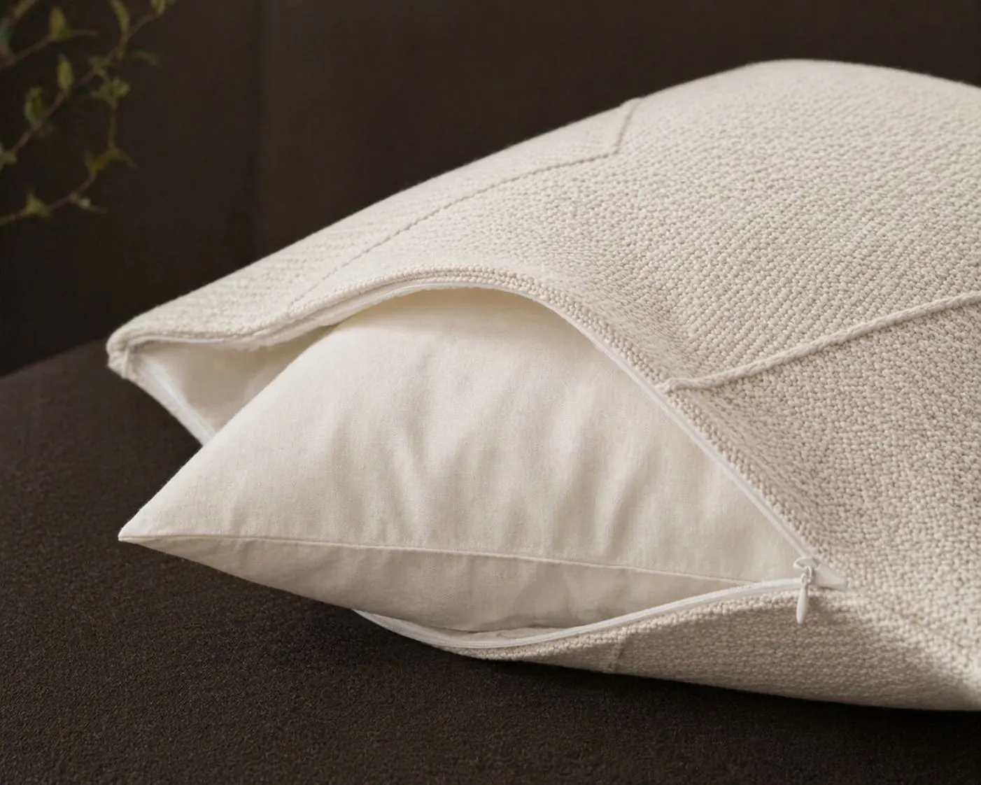 Cushion cover unzipped, showing inner pillow